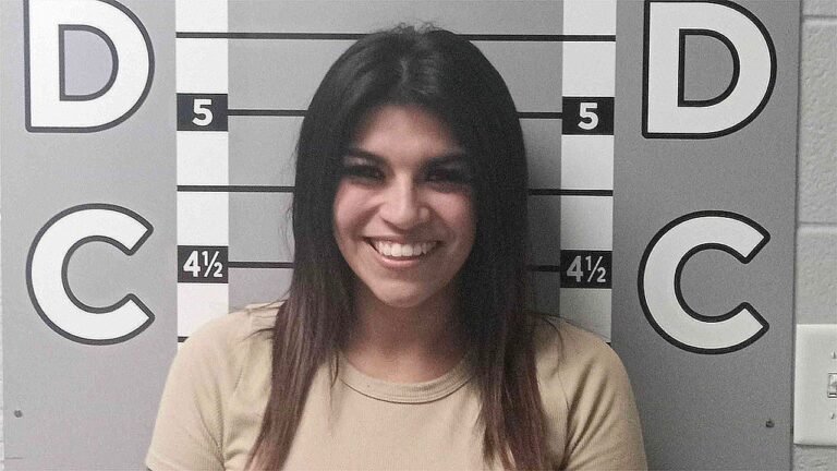 Woman's smiling mugshot goes viral after alleged $12K car vandalism spree against ex-boyfriend