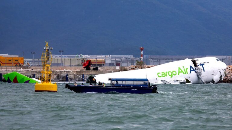 Hong Kong cargo plane skids off runway, killing two