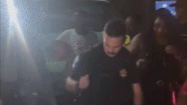 Officer's smooth dance moves convince partygoers to turn down music