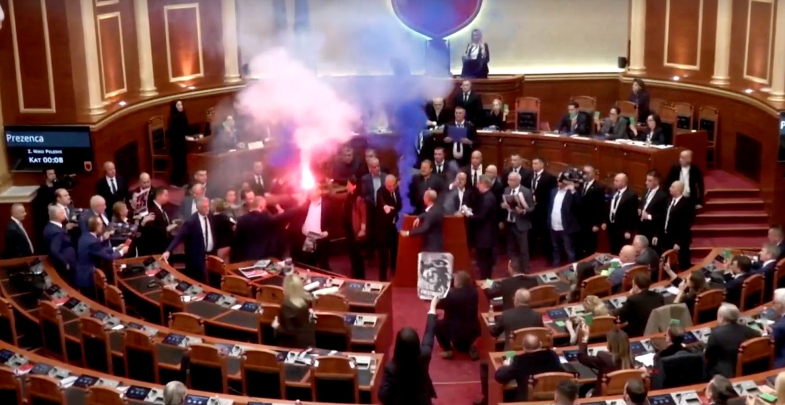 Albanian opposition lawmakers disrupt parliament with smoke flares and furious attacks on socialist PM