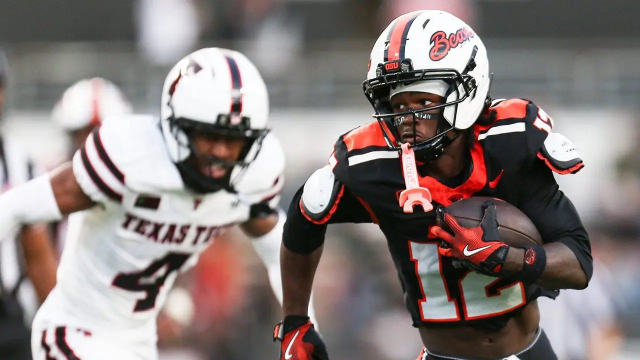 College football's NIL and transfer portal chaos on display as nation's top receiver holds absurd ceremony