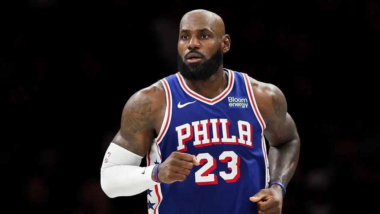 LeBron James doubles down with sneaky golf hip turns during national anthem after Trump's 'total disgrace' dig