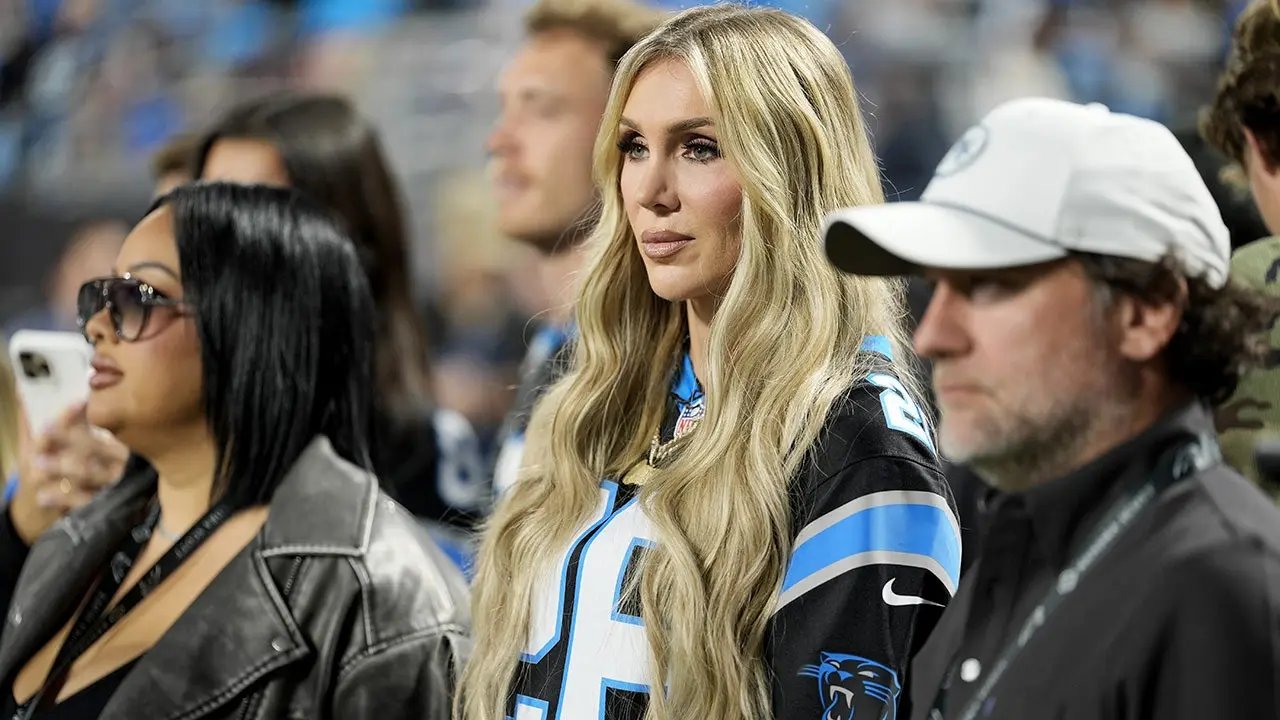 WWE star Charlotte Flair struts into Panthers' stadium, bangs the drum before game vs Lions